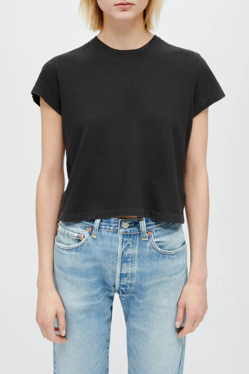 front profile model wearing  1950's Boxy Short Sleeve Tee Faded Black Boxy Crop Tee
Crew neck
Short sleeve
Loose fit
100% combed cotton