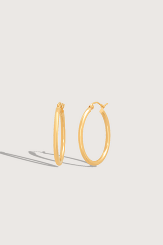 flat lay 1" Skinny Hoops 14k Yellow Gold