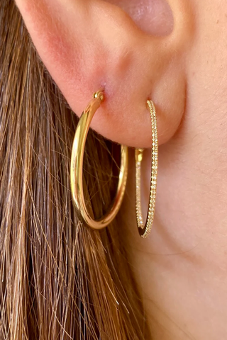 model wearing 1" Skinny Hoops 14k Yellow Gold