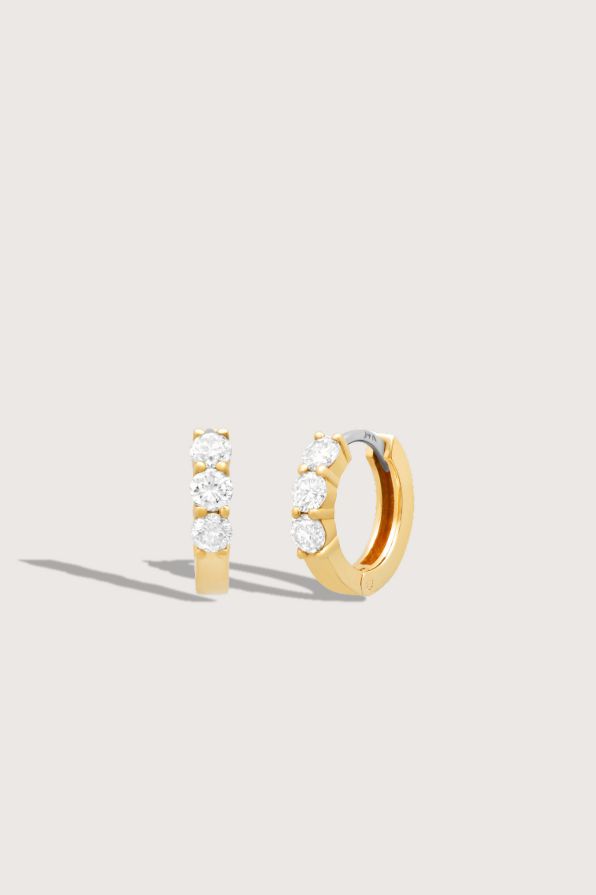 flat lay 3 Diamond Huggies 14k gold