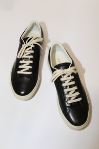 top profile Achilles Sport Premium black leather upper off white rubber sole lace up sleek slim style gold stamp numbers on the side