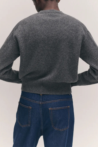 back profile model wearing Ada Crew Neck Cardigan Derby Grey subtly slouchy relaxed silhouette
Trocus shell buttons
100% Geelong Lambswool
Mid-weight
100% Scottish Spun yarn