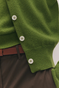 close up detail texture of Ada Crew Neck Cardigan Green lambswool relaxed fit crewneck with white buttons