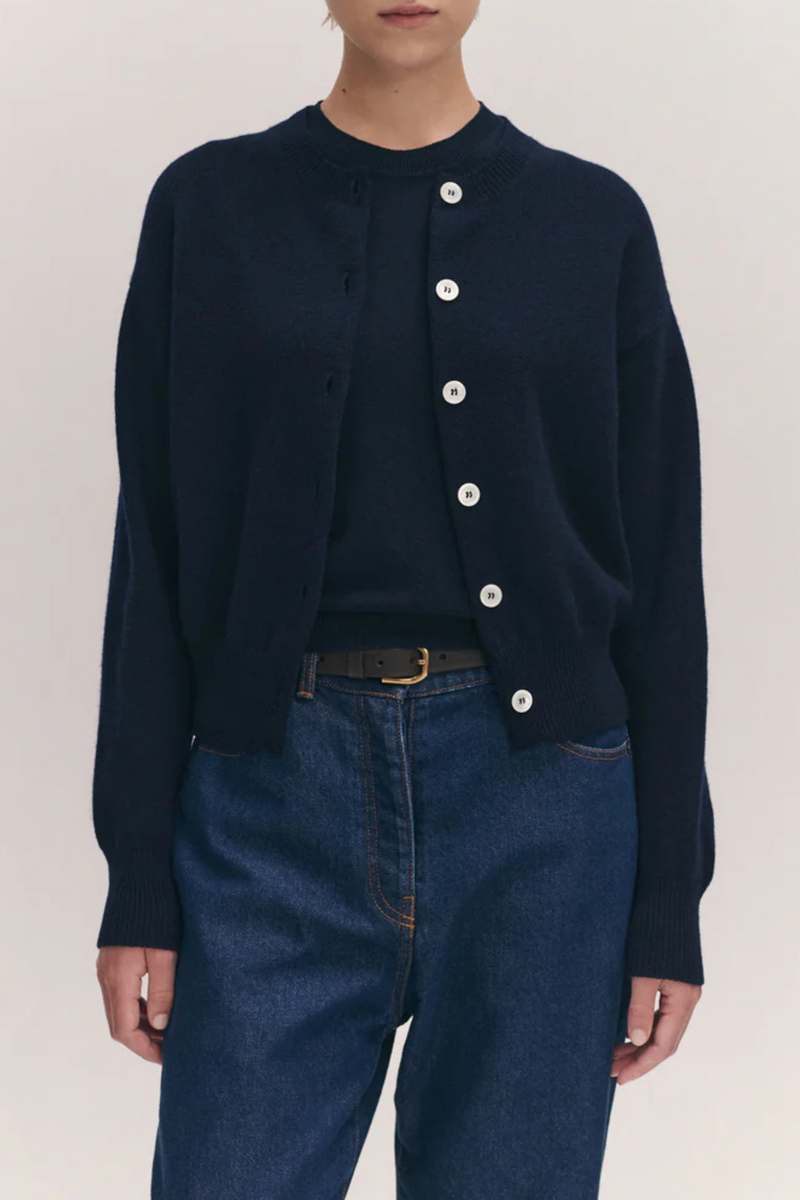 front profile model wearing Ada Crew Neck Cardigan Navy lambswool relaxed fit