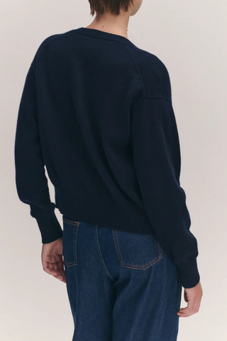 back profile model wearing Ada Crew Neck Cardigan Navy lambswool relaxed fit