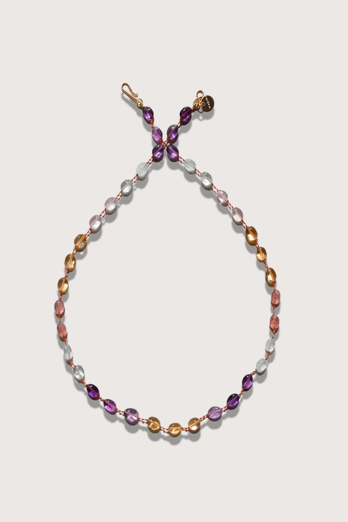 flat lay Addison Multi Color Stone Necklace with 14K Gold-filled ‘Infinity’ Clasp