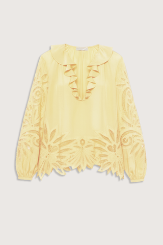 flat lay Adonis Silk Top dandellion yellow Botanical embroidery
Silk crepe de chine
Relaxed fit
V-neckline with ruffles long sleeves with elastic cuffs
Pullover style