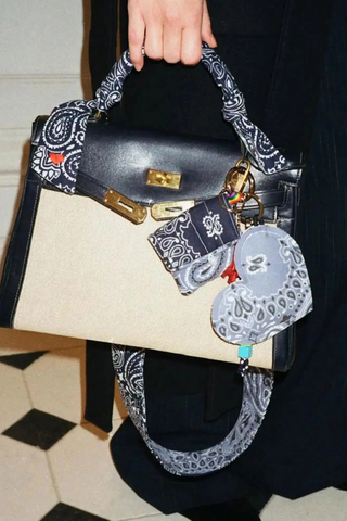 model wearing Airpods Case Navy/Chambray bandana cotton with snap hook