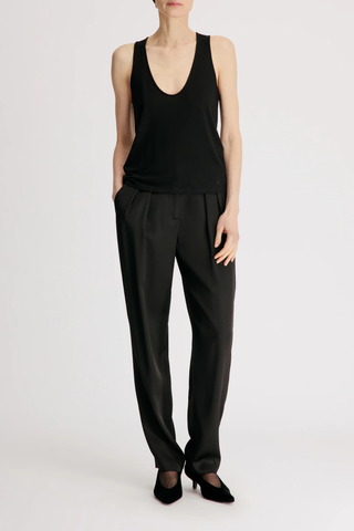front profile model wearing Albia U Wool Blend Tank Top black Fine wool blend jersey
Plunging U neckline
Fine shoulder straps
Fluid, dynamic texture
70% Viscose 30%Wool