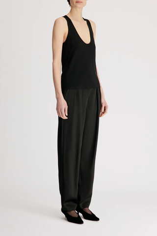 side profile model wearing Albia U Wool Blend Tank Top black Fine wool blend jersey
Plunging U neckline
Fine shoulder straps
Fluid, dynamic texture
70% Viscose 30%Wool