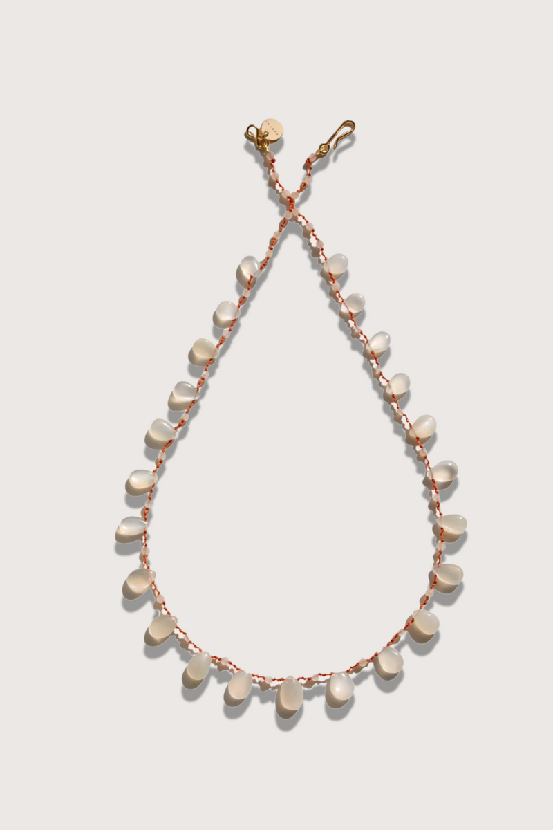 flat lay Alcyona White Moon Stone Necklace with Clasp: ‘Infinity’ 14K gold-filled