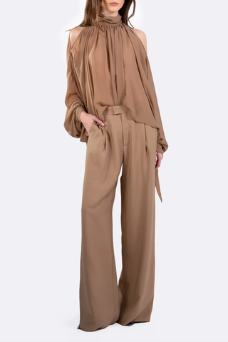 front profile model wearing Alexis Mid Rise Trouser Camel Mid-rise waist
Relaxed wide-leg
Front pleats
Hidden hook-and-clasp closure
100% Polyester