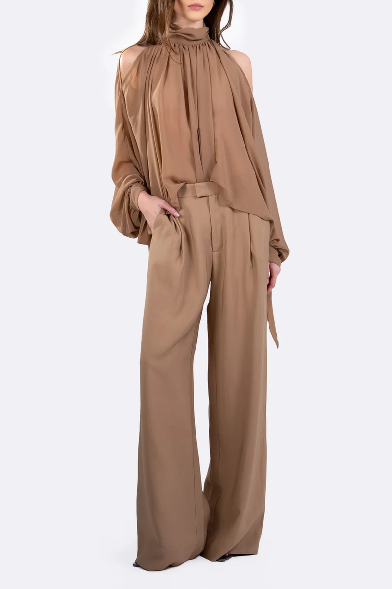 front profile model wearing Alexis Mid Rise Trouser Camel Mid-rise waist
Relaxed wide-leg
Front pleats
Hidden hook-and-clasp closure
100% Polyester