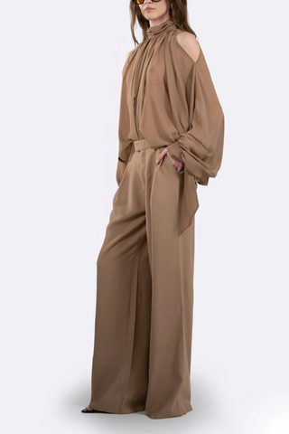 side profile model wearing Alexis Mid Rise Trouser Camel Mid-rise waist
Relaxed wide-leg
Front pleats
Hidden hook-and-clasp closure
100% Polyester