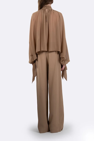 back profile model wearing Alexis Mid Rise Trouser Camel Mid-rise waist
Relaxed wide-leg
Front pleats
Hidden hook-and-clasp closure
100% Polyester