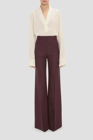 front profile model wearing Alina Flannel Pant Acai (Merlot) Compact flannel wool
High waist
Wide leg
Front patch pockets
100% Wool fits waist with looser leg