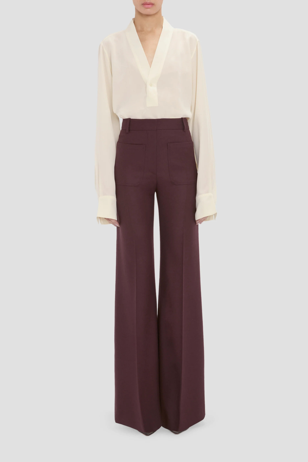 front profile model wearing Alina Flannel Pant Acai (Merlot) Compact flannel wool
High waist
Wide leg
Front patch pockets
100% Wool fits waist with looser leg