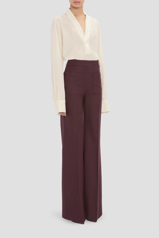 side profile model wearing Alina Flannel Pant Acai (Merlot) Compact flannel wool
High waist
Wide leg
Front patch pockets
100% Wool fits waist with looser leg