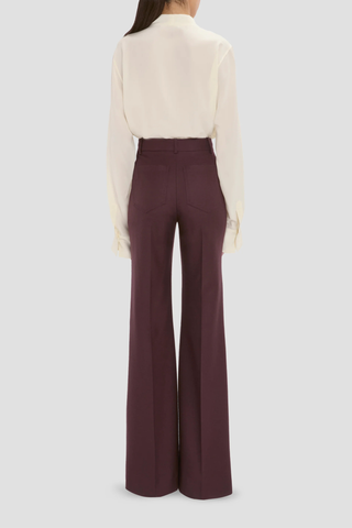 back profile model wearing Alina Flannel Pant Acai (Merlot) Compact flannel wool
High waist
Wide leg
Front patch pockets
100% Wool fits waist with looser leg