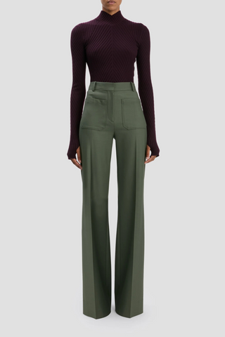 front profile model wearing Alina Trouser Oregano high  rise wide leg with front and back patch pocket