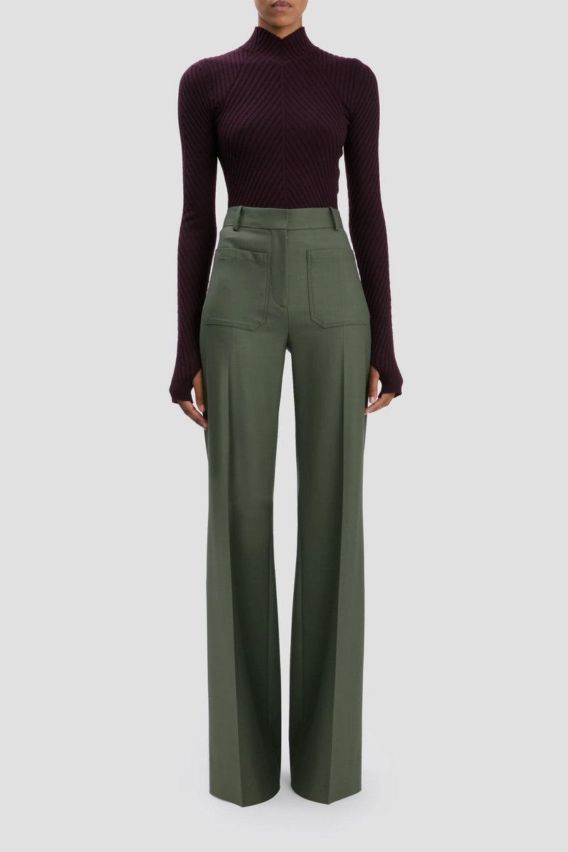 front profile model wearing Alina Trouser Oregano high  rise wide leg with front and back patch pocket