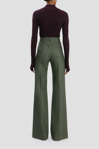 back profile model wearing Alina Trouser Oregano high  rise wide leg with front and back patch pocket