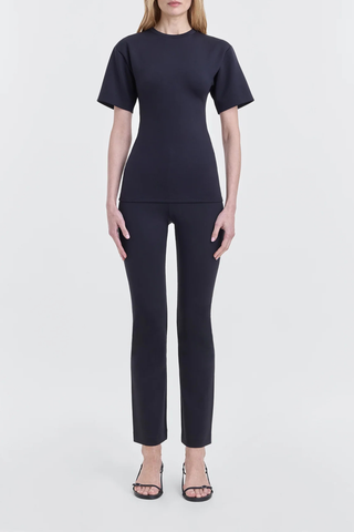 front profile model wearing Aline Scuba Straight Leg Trousers black Slim fit pant
Stretch scuba jersey
Minimal tubular waistband construction
