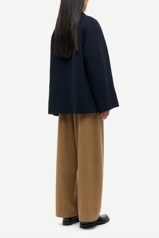 back profile model wearing Alma Wool Blend Zip Front Jacket navy blue pointed collar relaxed fit raglan sleeves