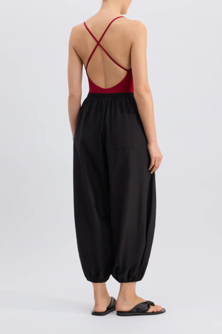 back profile model wearing Almaya Balloon Pant Black Balloon trousers
Mid-rise fit
Wide leg gathered at the ankles
Cocoon-like silhouette
Side seam pockets
Elasticated waistband
65% Cotton, 35% Silk Voile