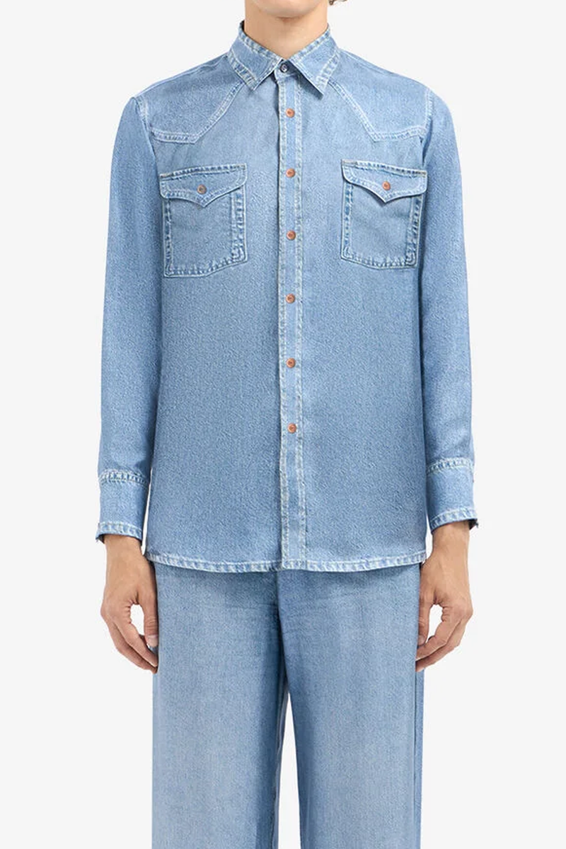 front profile model wearing Aloe Silk Shirt Light Blue Silk shirt with denim effect reimagines a western classic with refined tailoring