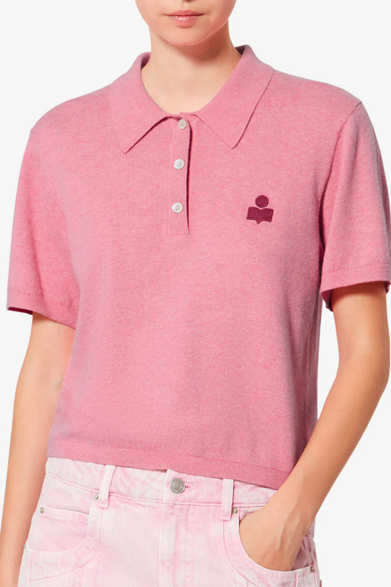 front profile model wearing Althea S/S Polo Bubblegum Cotton and wool blend knit polo
Polo collar extending into a button tab
Short sleeves
"IM" logo embroidered on the chest
Ribbed finishes
Fitted cut
70% cotton (1), 30% wool