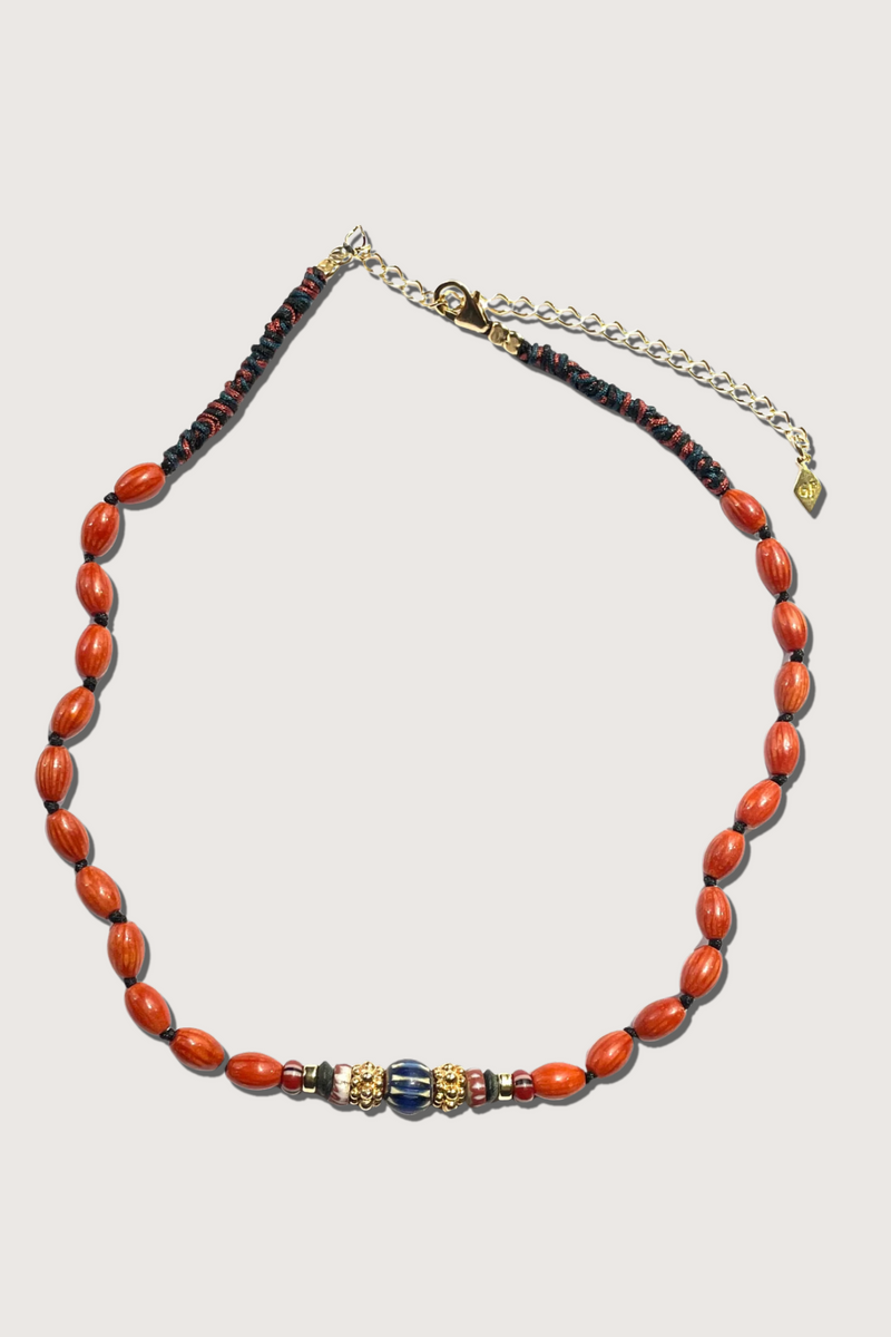flat lay Amber Coral Necklace Handwoven necklace set with oval bambou stones, black jade, vintage African glass beads and 18K gold-plated.

Each piece is one of a kind.

Length: 16"-18"- Adjustable.

Handmade in Gachon Pothier's Parisian workshop.