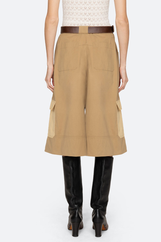 back profile model wearing Andrea Culottes yellow khaki multi Workwear culottes
Cropped wide-leg silhouette
Two-tone coloring
Includes a leather belt
100% cotton
