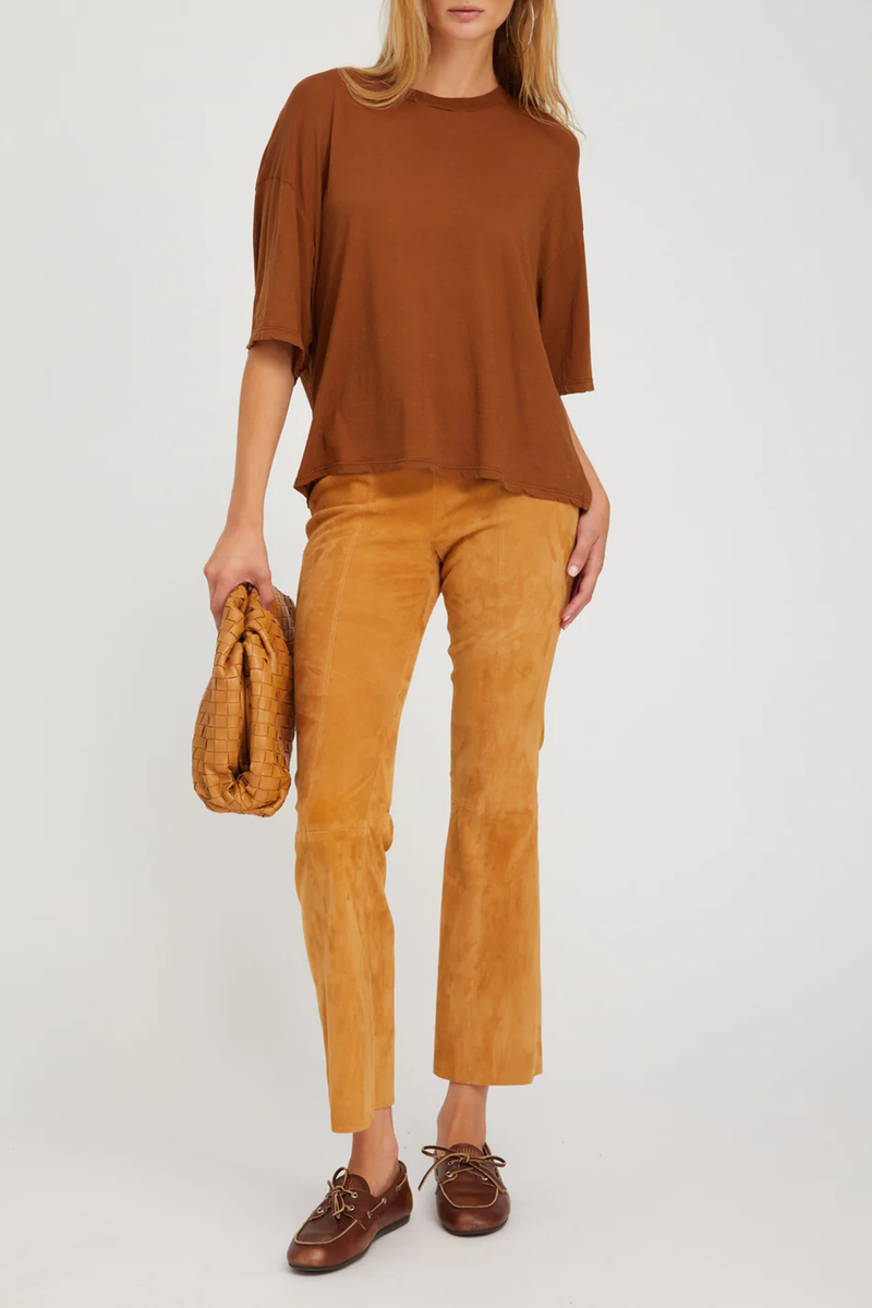 front profile model wearing Ankle Flare pants with princess seam suede nutmeg with Elastic waistband, pull-on fit