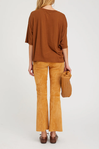 back profile model wearing Ankle Flare pants with princess seam suede nutmeg with Elastic waistband, pull-on fit