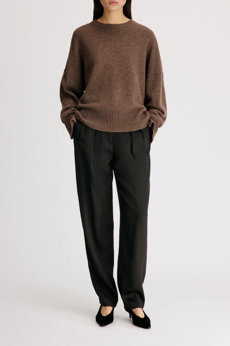 front profile model wearing Anton Crew Cashmere Sweater Coffee brown Slightly oval fit
Enveloping, effortless silhouette
Crew neck
Drop shoulders
Ribbed details
Vented cuffs
100% Cashmere