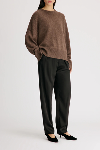side profile model wearing Anton Crew Cashmere Sweater Coffee brown Slightly oval fit
Enveloping, effortless silhouette
Crew neck
Drop shoulders
Ribbed details
Vented cuffs
100% Cashmere