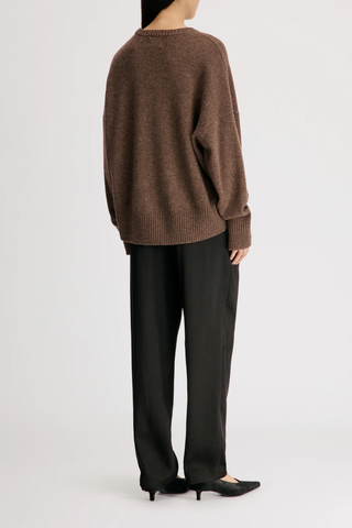 back profile model wearing Anton Crew Cashmere Sweater Coffee brown Slightly oval fit
Enveloping, effortless silhouette
Crew neck
Drop shoulders
Ribbed details
Vented cuffs
100% Cashmere
