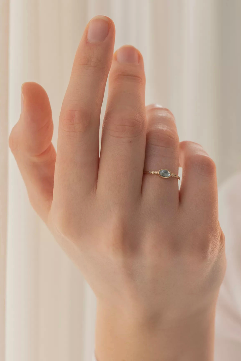 model wearing Aquamarine & Six Small Diamond Ring 14k light yellow gold
One central Aquamarine
Six diamonds