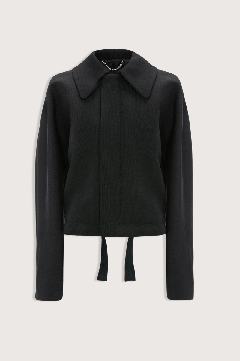 flat lay Arden Bomber Jacket black oversized fit Soft heavy gabardine
Hip length style with an oversized shoulder
Zip and Popper fastening
Side pockets and adjustable tied hem
100% Virgin Wool