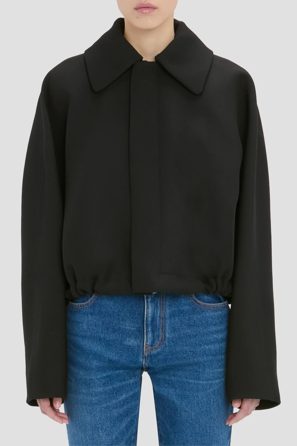 front profile model wearing Arden Bomber Jacket black oversized fit Soft heavy gabardine
Hip length style with an oversized shoulder
Zip and Popper fastening
Side pockets and adjustable tied hem
100% Virgin Wool