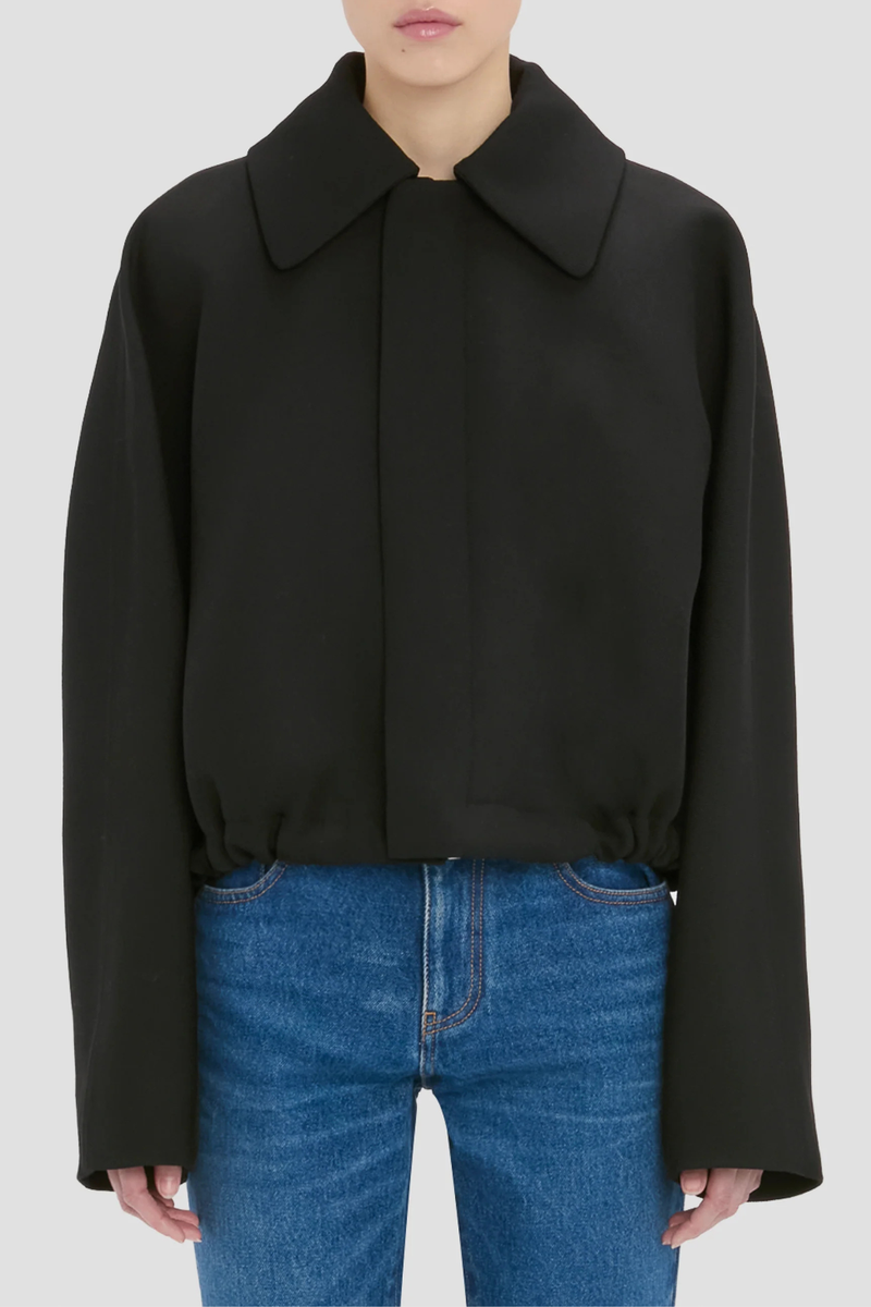 front profile model wearing Arden Bomber Jacket black oversized fit Soft heavy gabardine
Hip length style with an oversized shoulder
Zip and Popper fastening
Side pockets and adjustable tied hem
100% Virgin Wool