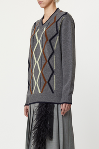side profile model wearing Argyle Cashmere Sweater, V-neck, Grey base, Ribbed neck, cuff and hems
Classic fit
