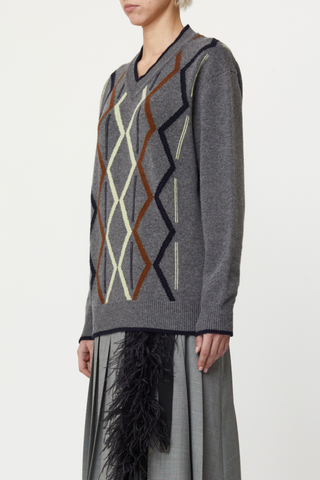 side profile model wearing Argyle Cashmere Sweater, V-neck, Grey base, Ribbed neck, cuff and hems
Classic fit