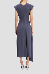 back profile model wearing Aria Twist Waist Dress eclipse muted blue grey Ankle length with asymmetric hem
Drape fabrication
Round front neckline
V-shape back
Cap sleeve
Twist waist
Concealed zip with hook &amp; eye closure
