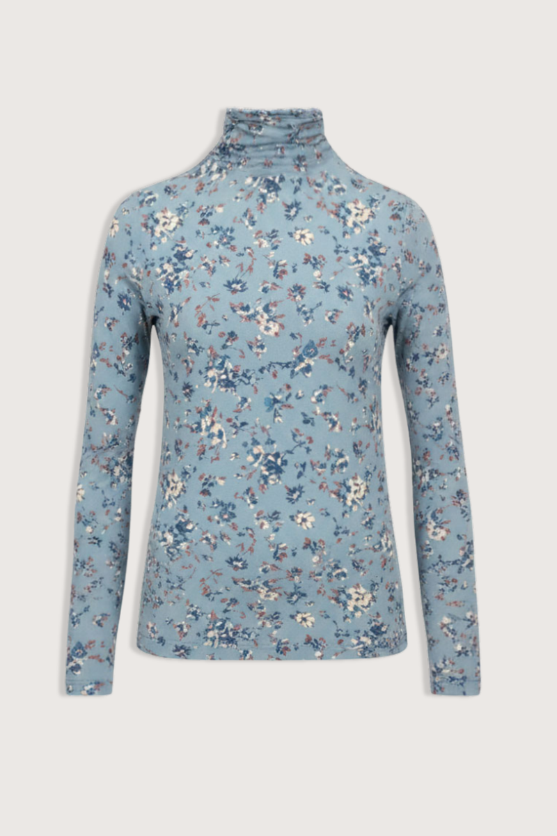 flat lay Aurelia Long Sleeve Turtle Neck Celeste blue with floral prints Turtleneck
Lightweight tricot jersey
bold, swirling ikat motifs based on a vintage print
&nbsp;Long-sleeve
Close slim fit
91% Rayon, 9% Elastane