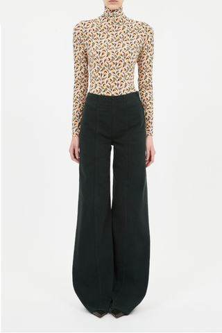 front profile model wearing Aurelia Long Sleeve Turtleneck Top Neck Swan print slim fit