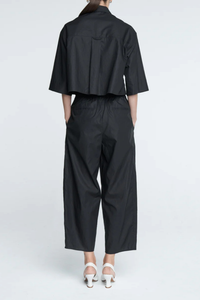 back profile model wearing Balloon Drawstring Trouser Black Added volume to the leg
Tapered bottom the trousers
Front pleats
Loose drawstring trousers
Slightly tapered bottom and pocketing
lightweight Organic Cotton