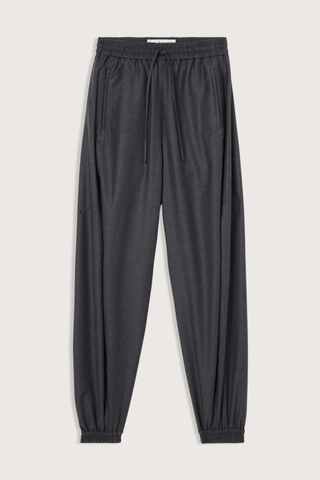flat lay Balloon Track Wool Pant dark grey melange Balloon track pants
Soft dark grey wool
Elasticated waistband and hem
Voluminous leg
Front welt pockets
100% wool