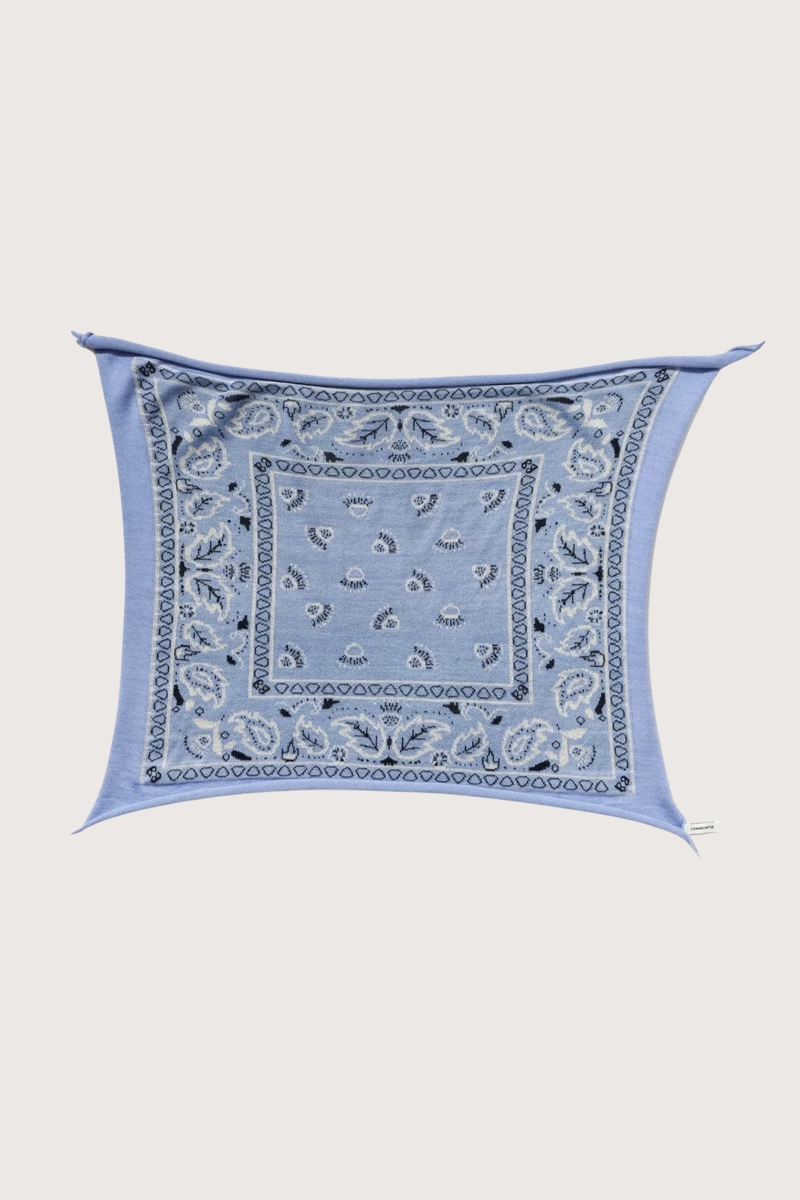 flat lay open Bandana Cashmere Scarf Sky  100% cashmere
Bandana print
Hand-knit construction
27" Width x 24" Length